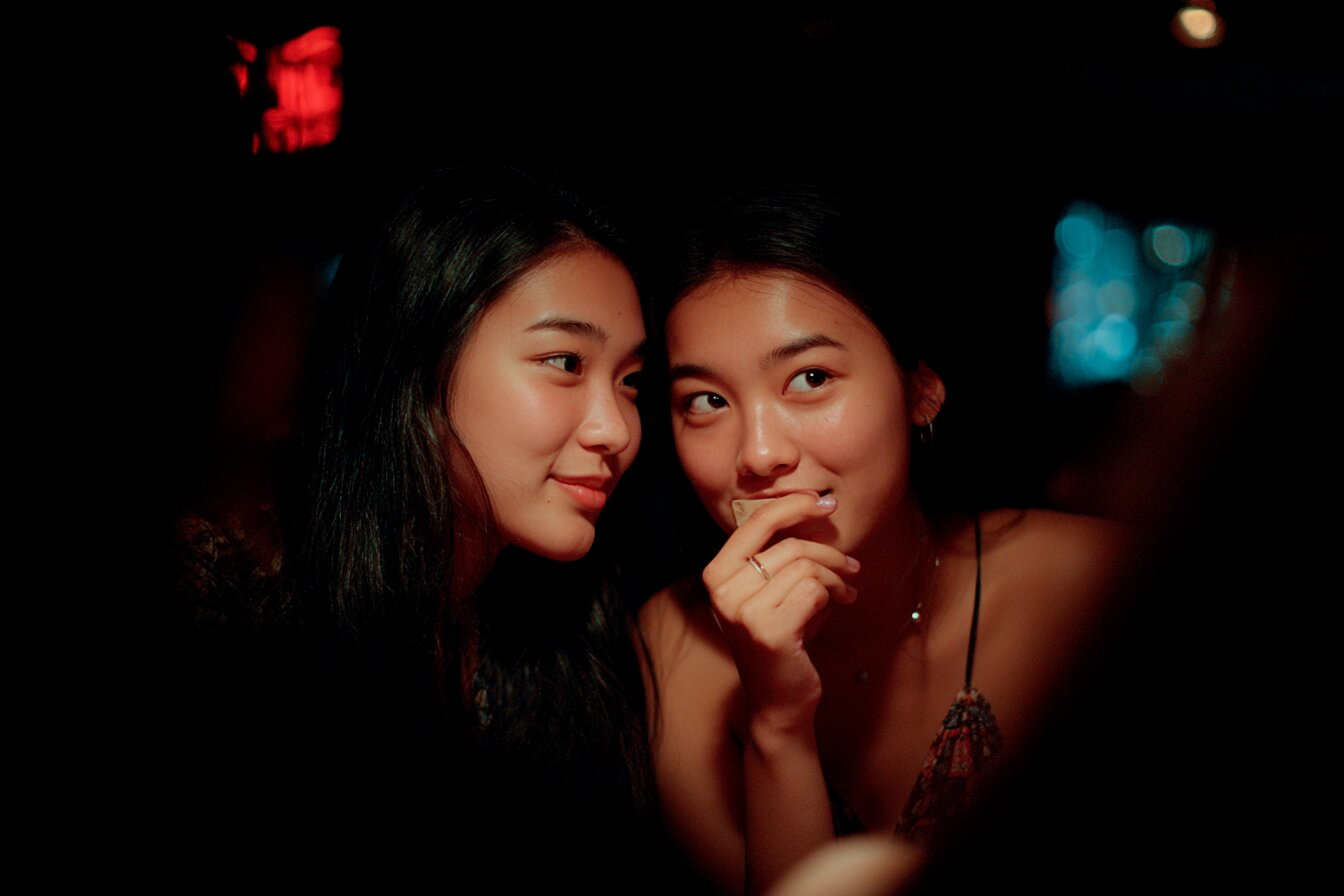 Beautiful Vietnamese baccarat dealer at live table